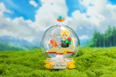 maqueta de construccion el principito sentado en un libro-6973817322815